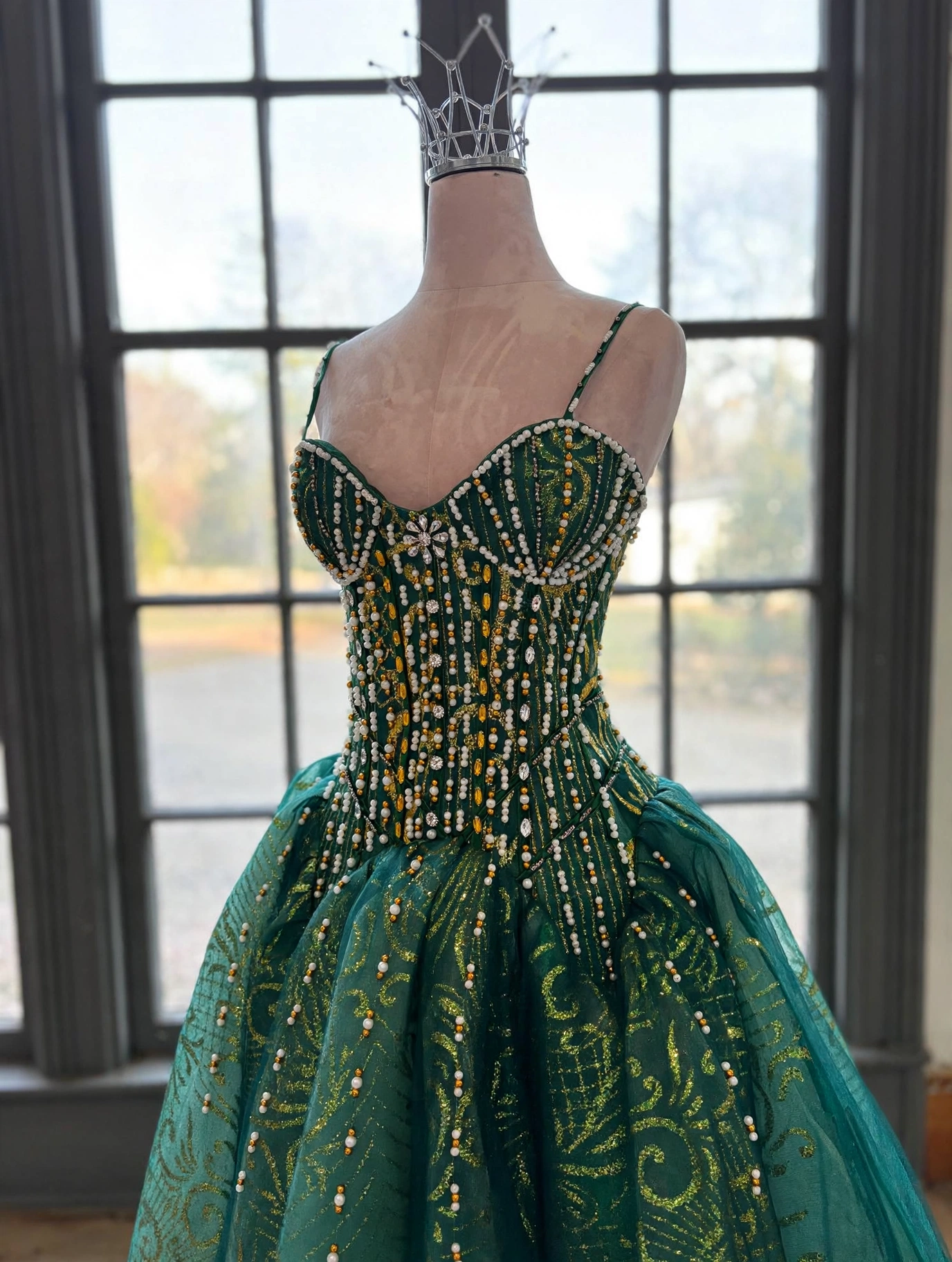 Close-up of pearl and bead bodice on emerald dress