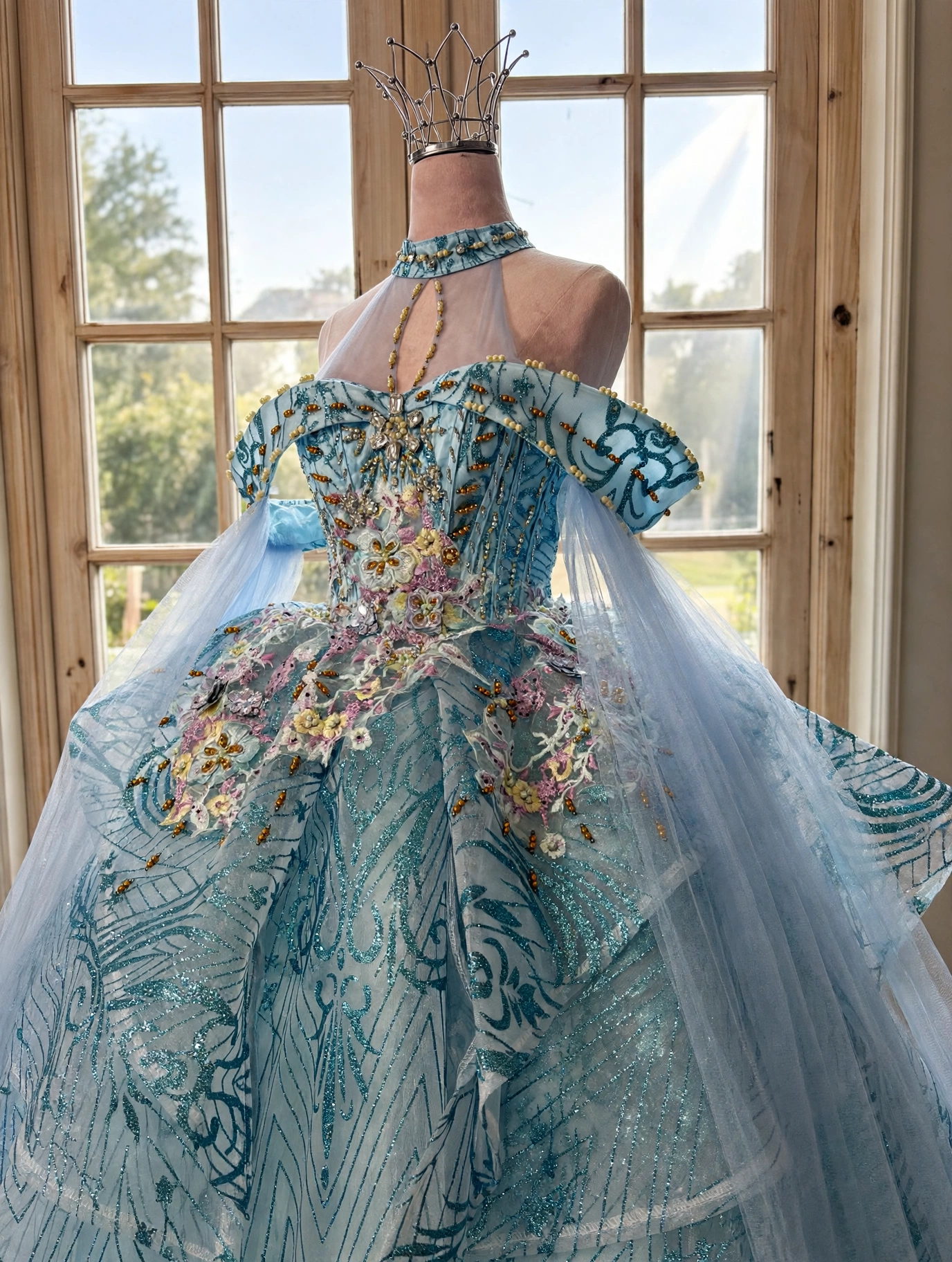 Close-up of halter neckline and beaded bodice on ice blue dress