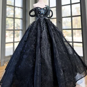 Black quinceanera dress with silver snowflake beading, off-the-shoulder