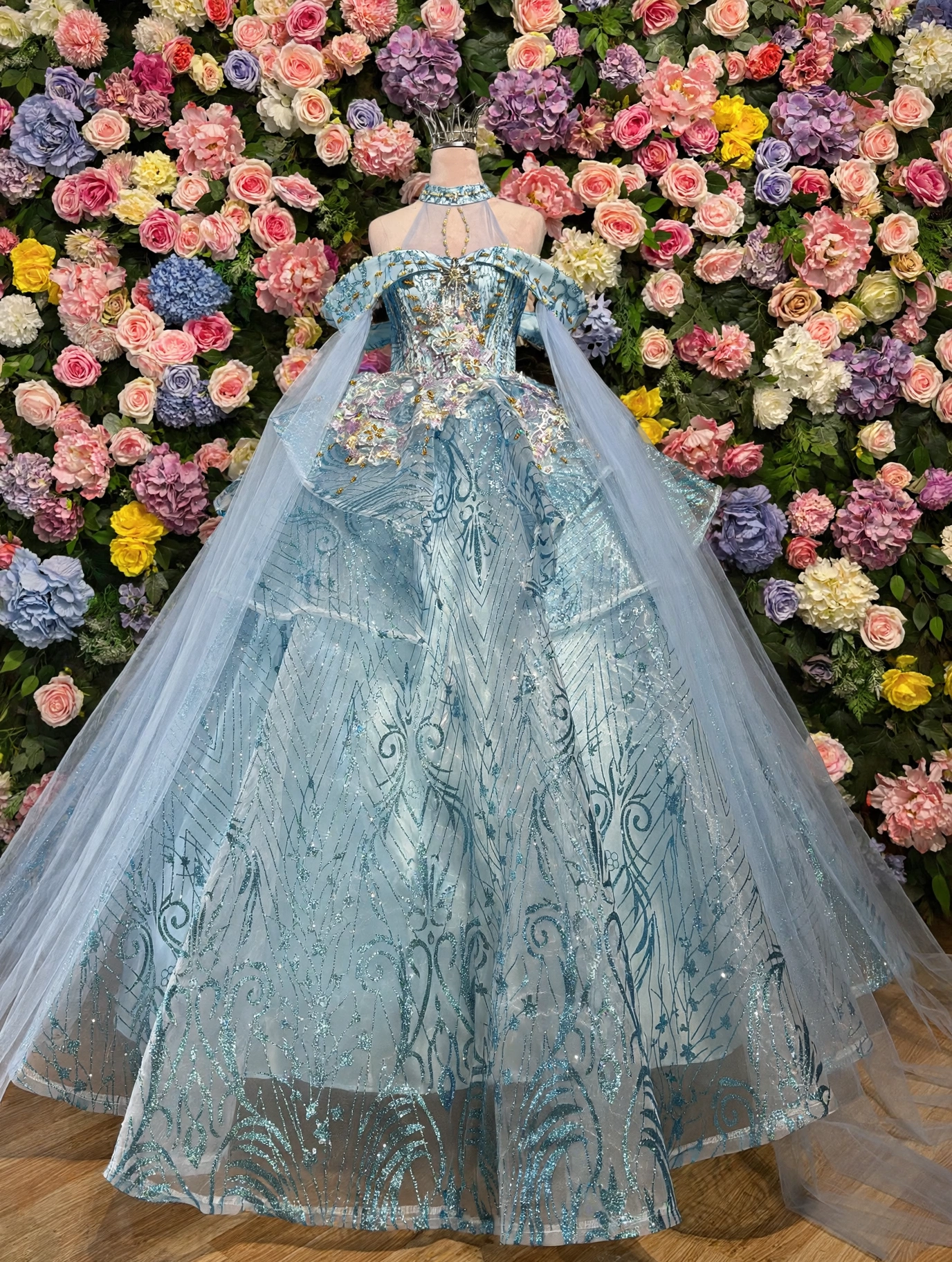 Ice blue halter quinceanera dress with sheer cape, front view