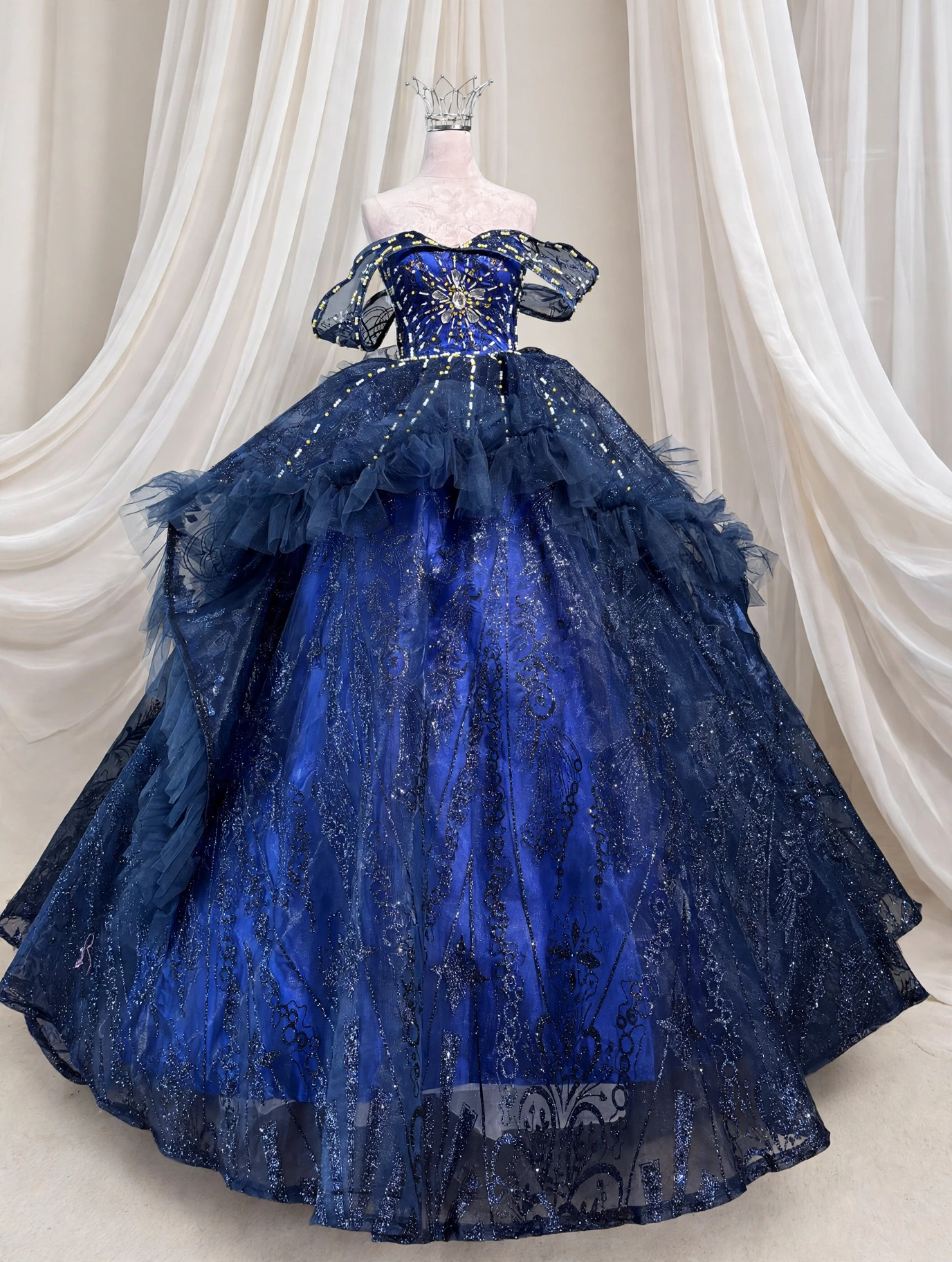 Midnight navy quinceanera dress with gold sunburst beading, front view