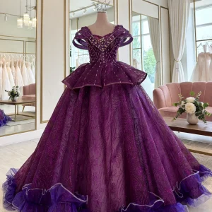 Purple quinceanera dress with heavily beaded bodice, front view