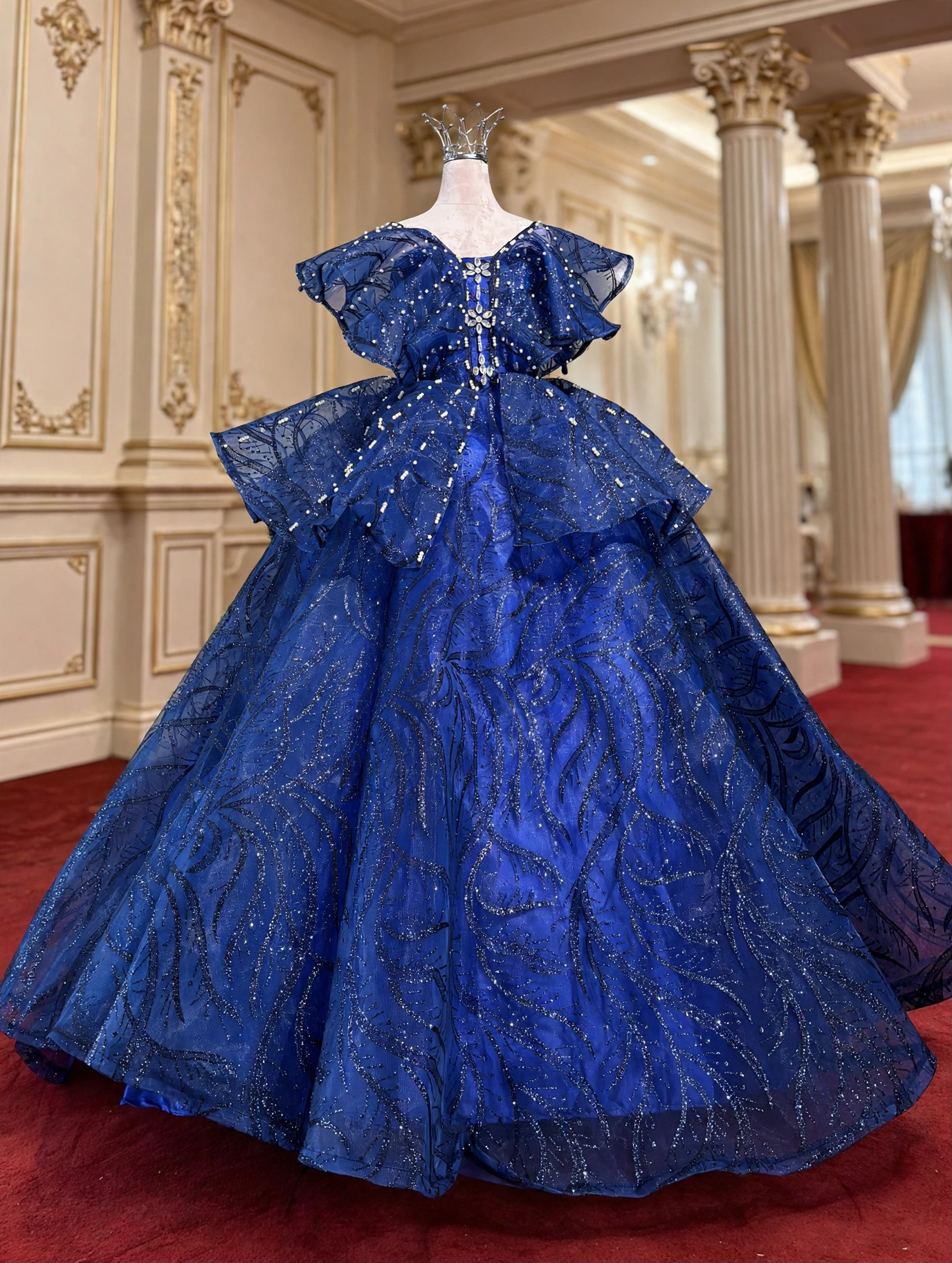 Royal blue glitter quinceanera dress with off-the-shoulder ruffles, front view